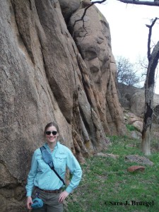 The author at the base of some worn rocks in Wichita Mountains. Photo copyright Sara J. Bruegel, 2016