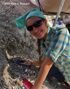 Sara Bruegel sorting through clay - some chunks are colorful